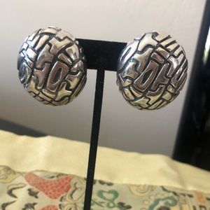 Sterling silver statement clip earrings. 1.5 by 1.25 inches. Contemporary design